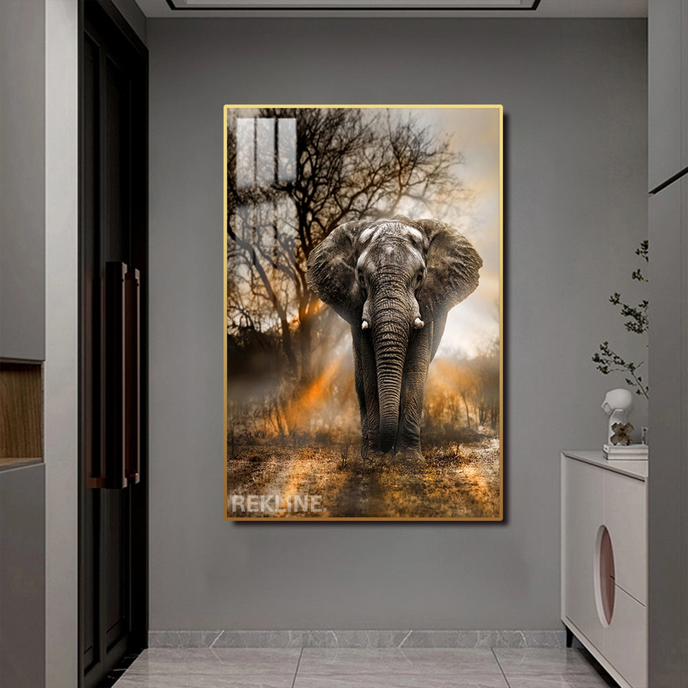 A majestic elephant walking toward the viewer at sunrise, printed on a canvas with LED backlighting in a gold frame