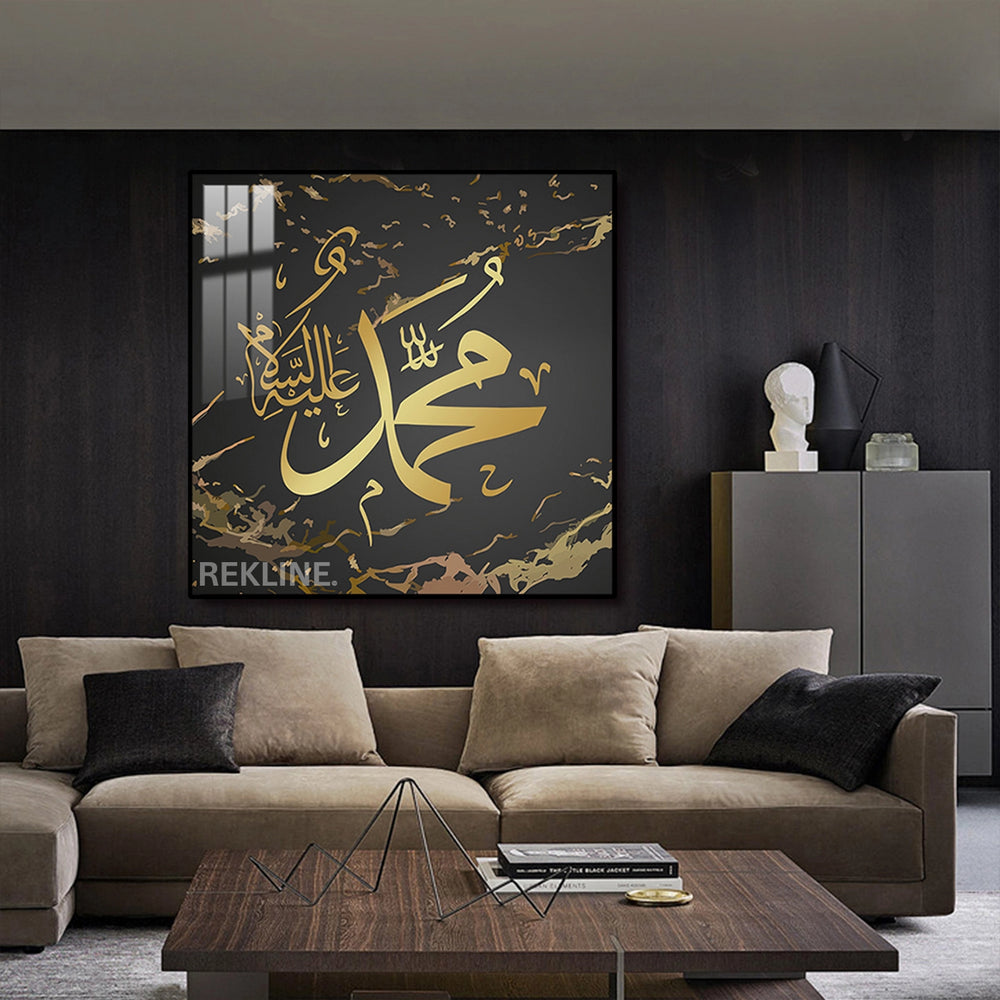 Close-up of gold Arabic calligraphy “محمد ﷺ” on dark canvas with subtle background illumination from hidden LEDs