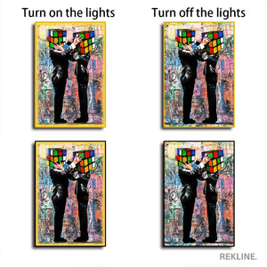 Rubik Cube Heads LED Canvas | 100×150 cm LED-Illuminated Crystal-Porcelain Rubik Cube Painting, Gold/Black Frame | By REKLINE