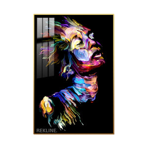 Abstract portrait of a woman’s face with multicolored brushstrokes on black canvas, softly illuminated by LEDs