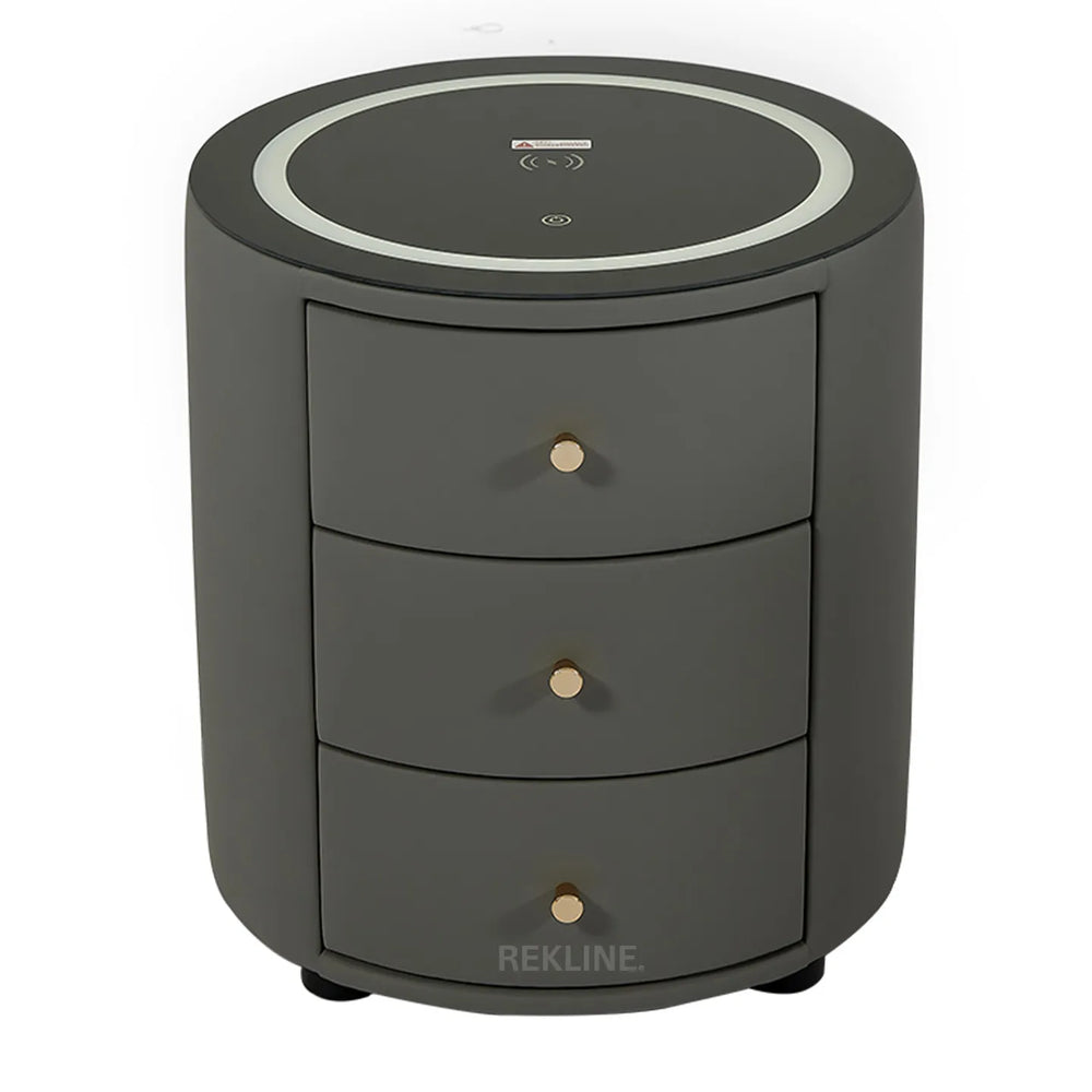 Gray 3-drawer bedside table with LED ring light, wireless charging pad, dual USB ports, and built-in Bluetooth speaker
