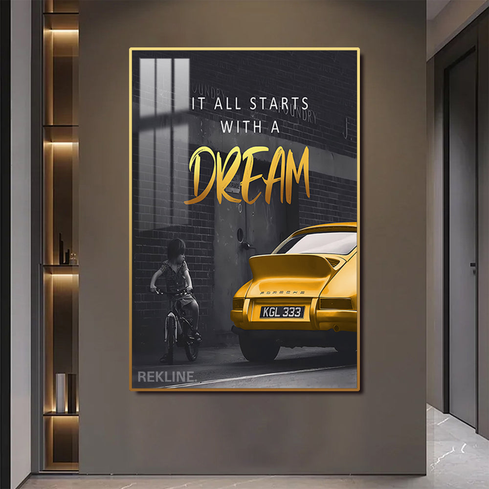 LED canvas of boy on bike gazing at yellow Porsche with quote “It all starts with a dream”, gold or black alloy frame.

