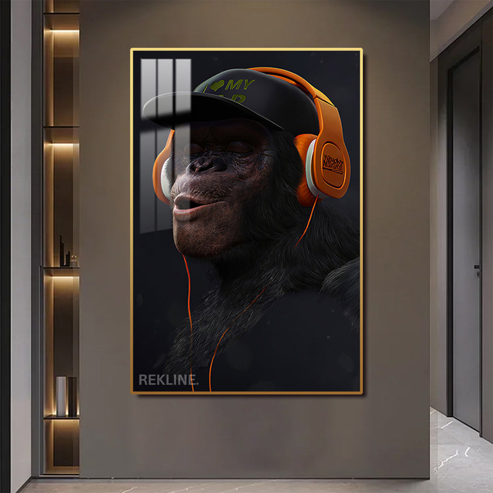 Chimpanzee wearing orange headphones and cap, LED canvas.
